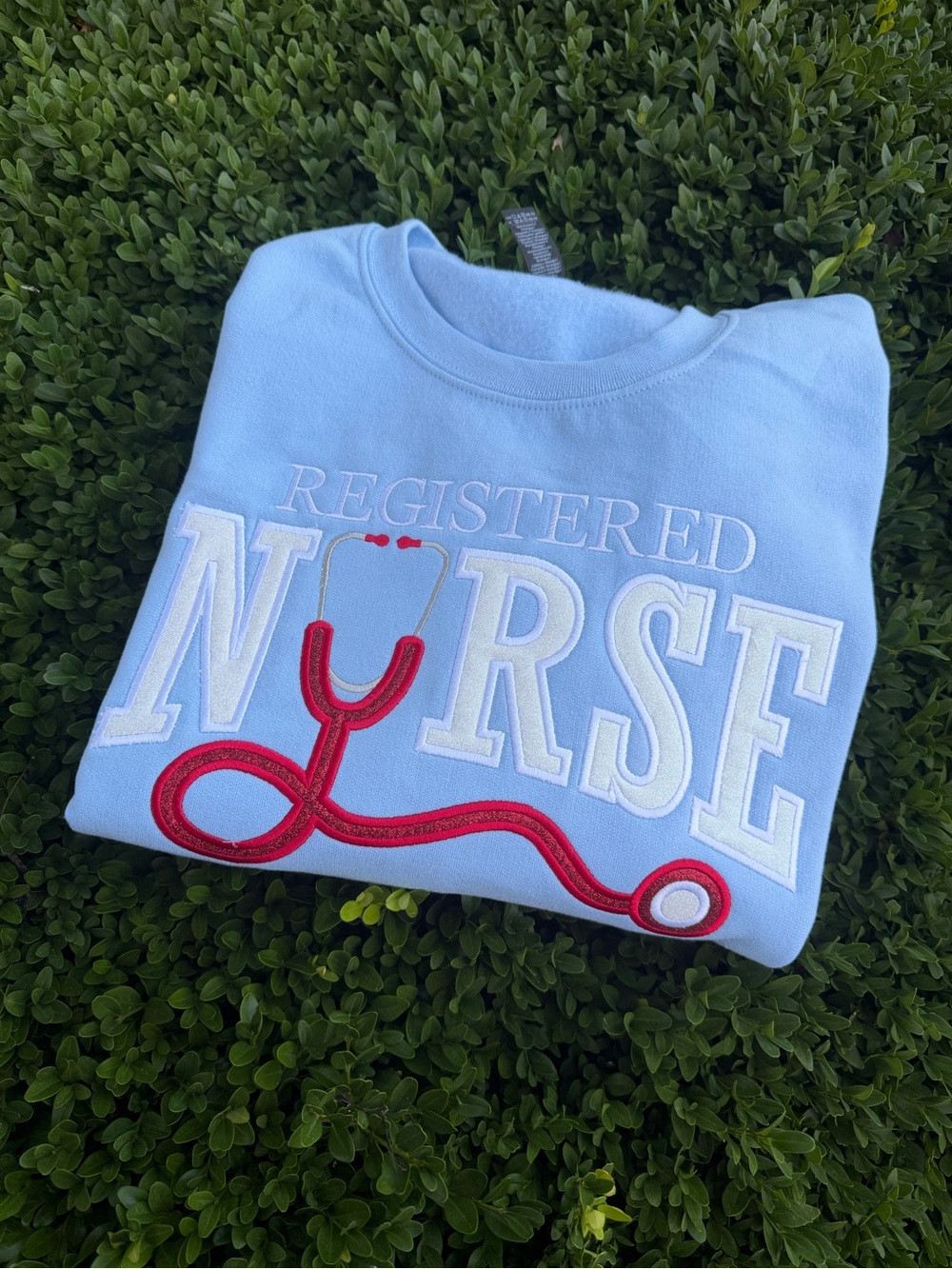 Registered Nurse Light Blue Sweatshirt with Red Stethoscope Appliqué Embroidered